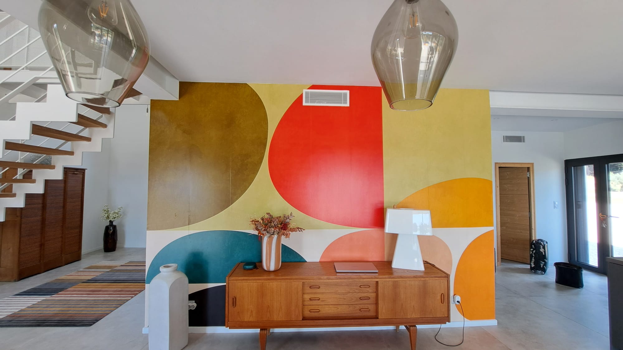 Entrance hall mural and staircase